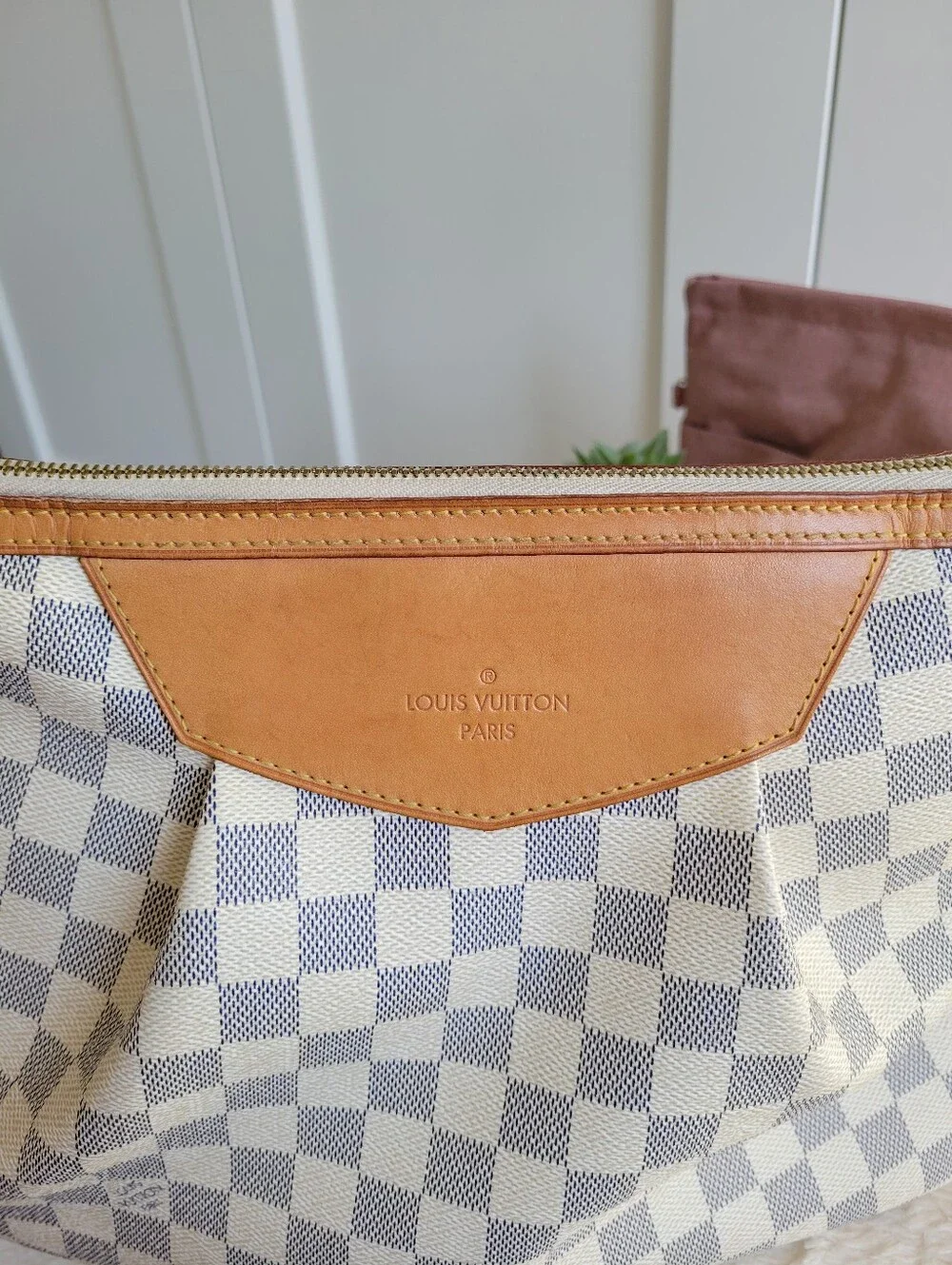Louis Vuitton signs but